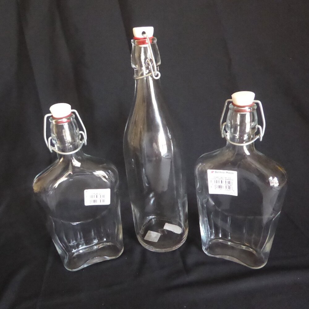 NEW 12.5” - 9.5” CRATE BARREL ITALY CLEAR GLASS AIR TIGHT LOCKING TOP 3 BOTTLES